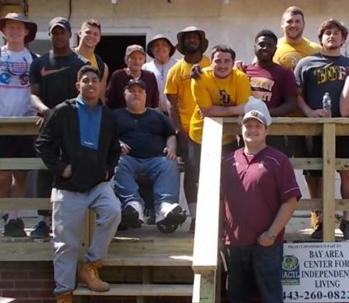 SU football team Chesapeake Housing Mission ramp build